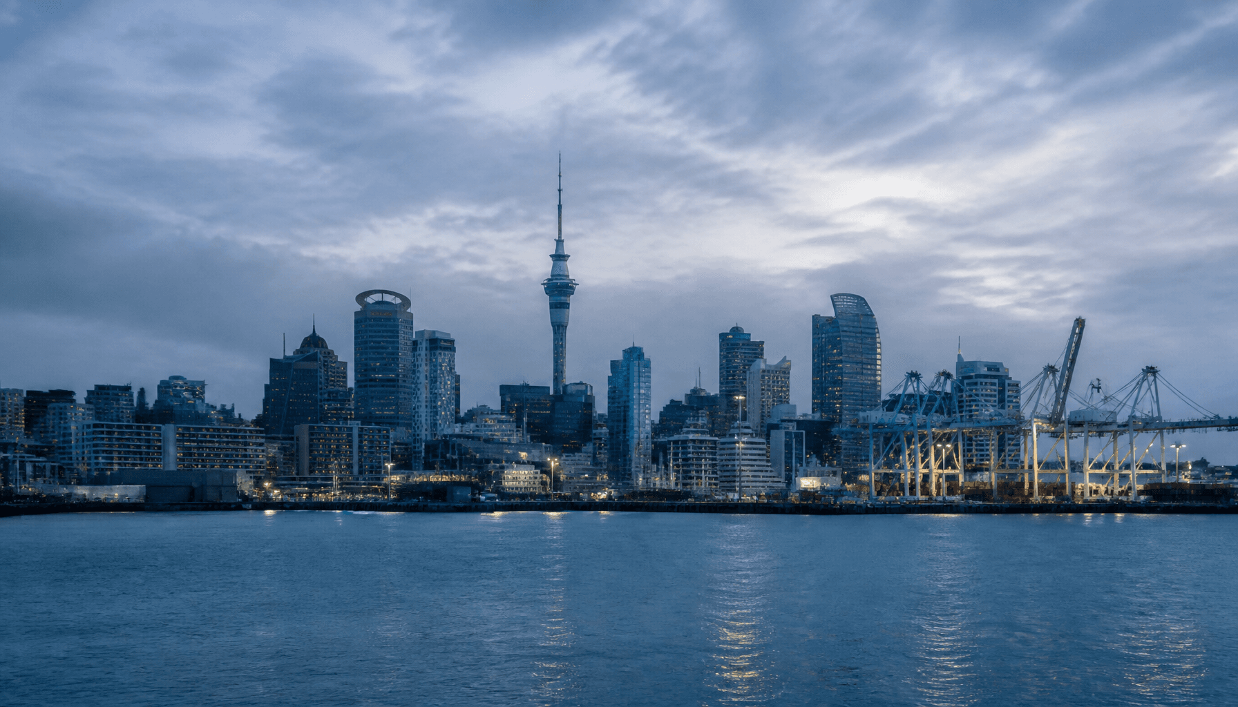 Auckland harbour and CBD commercial waterfront under overcast light