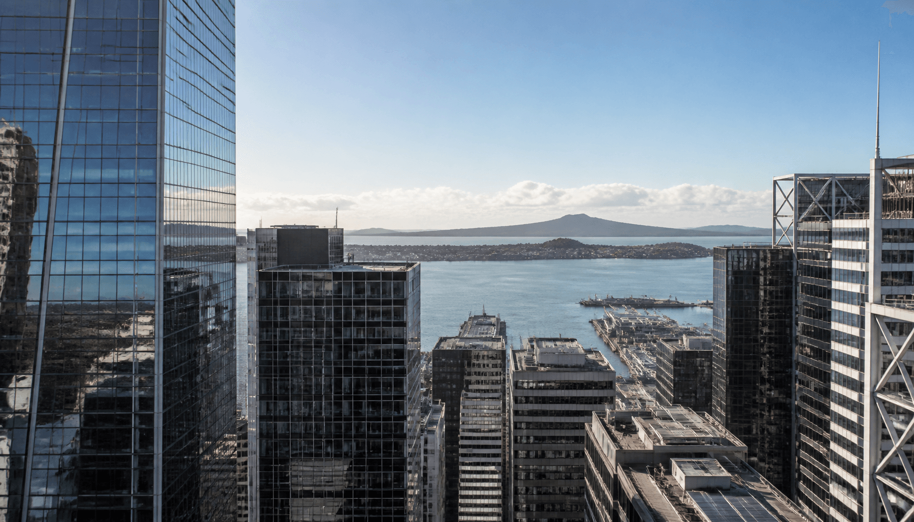Auckland CBD office towers overlooking the harbour on a clear morning