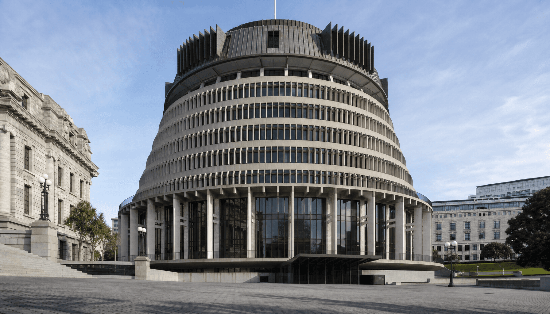 The Beehive building exterior in Wellington on a clear morning, empty plaza foreground