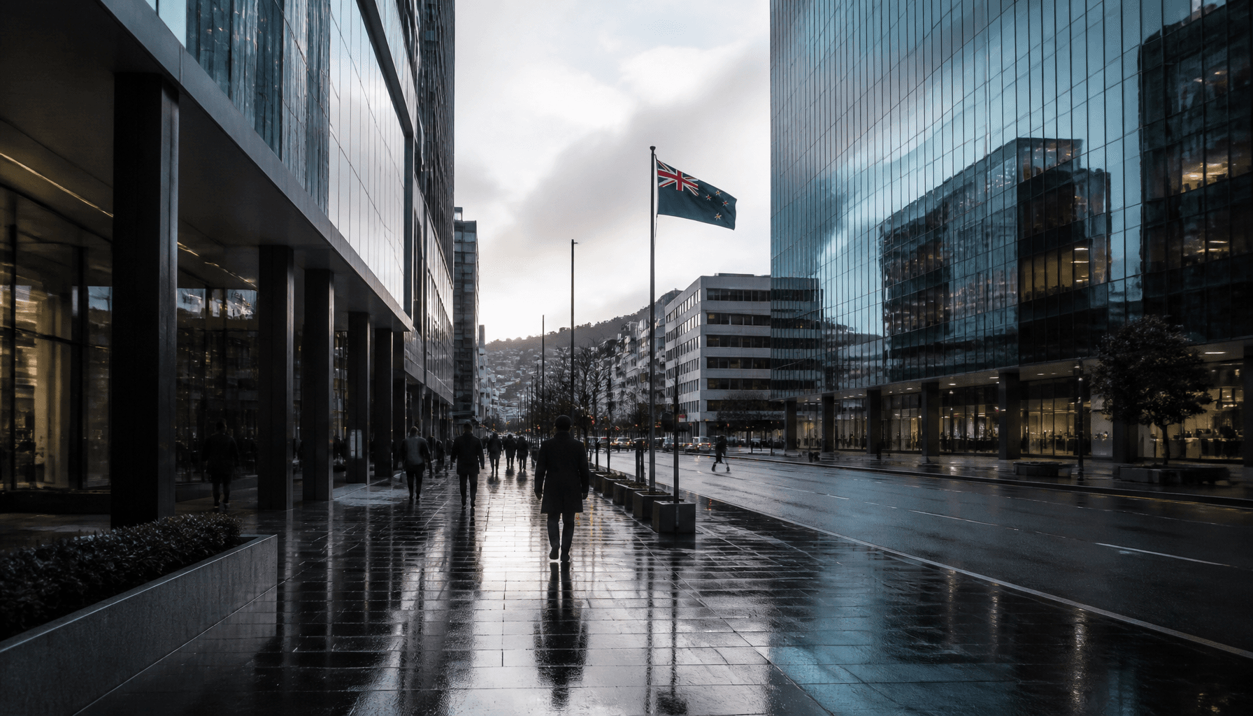 Wellington's Lambton Quay business district at dawn with office towers and a New Zealand flag