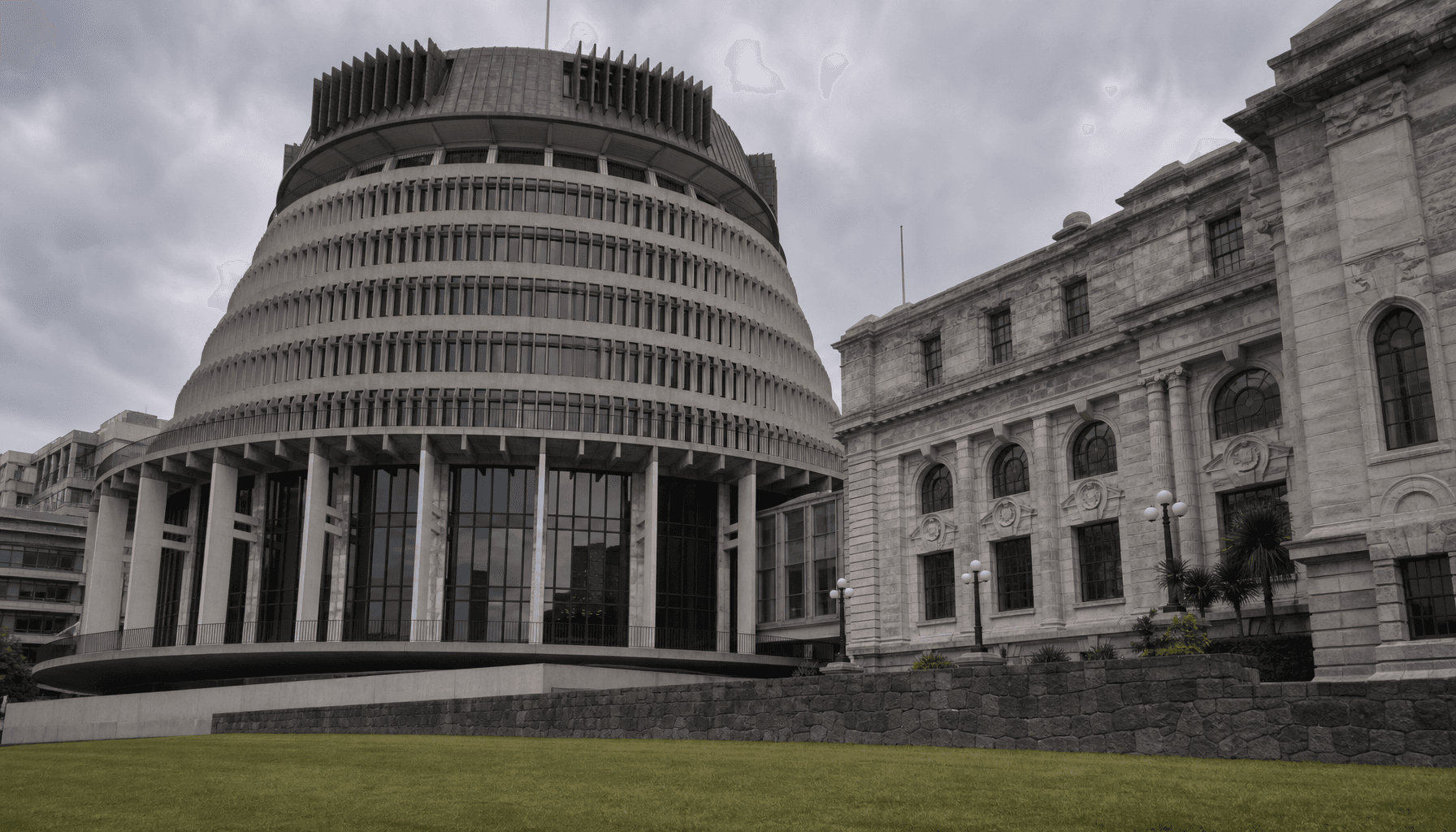 The Beehive executive wing of New Zealand's Parliament Buildings in Wellington under an overcast sky